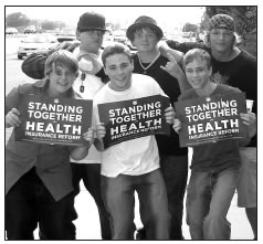 YOUTH SHOWING THEIR SIGNS SUPPORTING OBAMA'S HEALTH CARE PROPOSALS