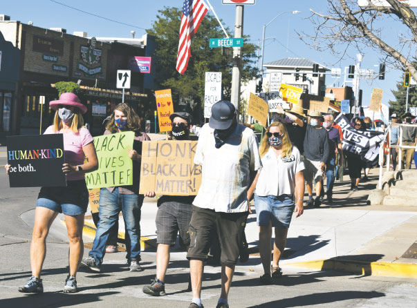Peace and Justice marchers walk along Cortez’s Main Street in September 2020.