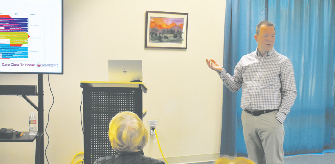 Southwest Health System CEO Joe Theine speaks to an audience at the Cortez Public Library in a presentation on Oct. 21. 